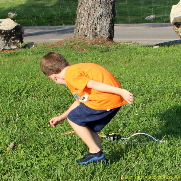 Make a sprinkler part of your obstacle course.