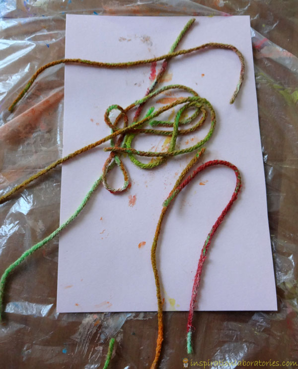 Place strings for pulled string painting