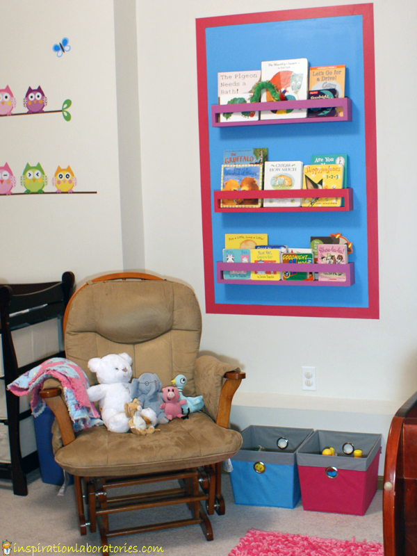 Our Nursery Reading Space: Colorful Bookshelves and Painted Wall Border