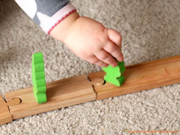 Use trains to explore cause and effect with your toddler.