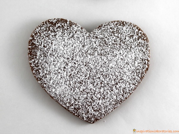Valentine brownie cookies decorated with powdered sugar.