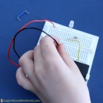 Make a simple LED circuit with a breadboard.