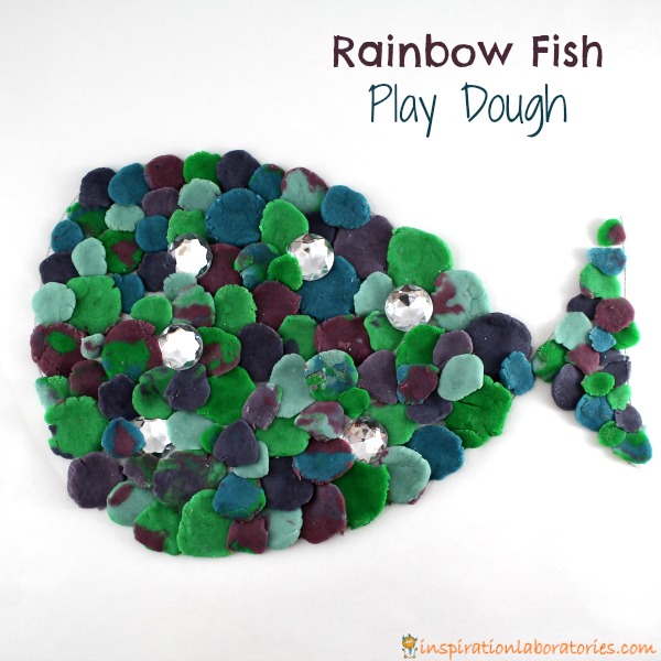Rainbow fish play dough is such a fun way to work on fine motor skills. It's the perfect sensory activity to go along with The Rainbow Fish by Marcus Pfister.