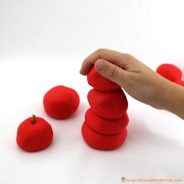 Try a play dough apple stacking activity after reading Ten Apples Up On Top by Dr. Seuss