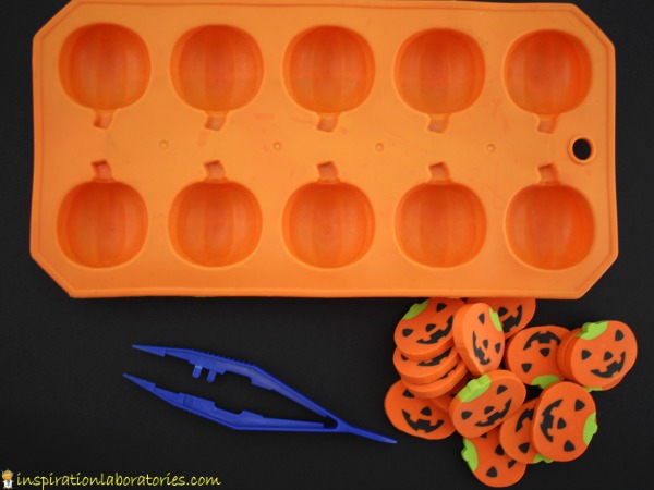 Use erasers for a simple Halloween fine motor game.