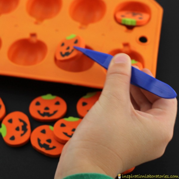 Use erasers for a simple Halloween fine motor game.