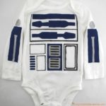 Use a freezer paper stencil to make an R2-D2 costume for baby.