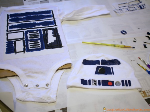 Use a freezer paper stencil to make an R2-D2 costume for baby.