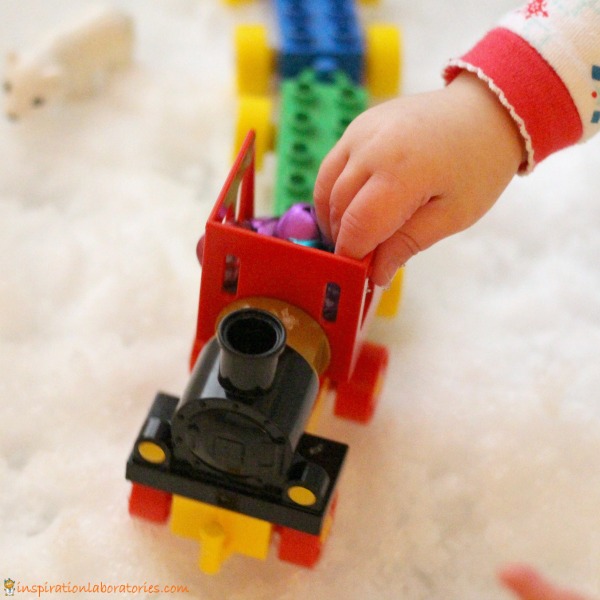 Create a snowy train sensory bin inspired by The Polar Express. Use real snow or make your own snow.