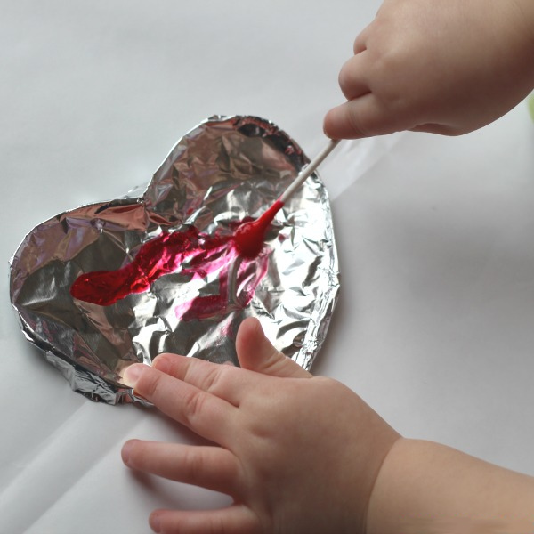 Make painted foil hearts for Valentine's Day.