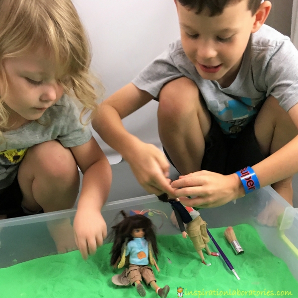 Set up a fossil hunting sensory bin with sand and fossils for your Lottie Dolls.