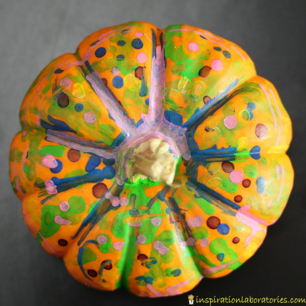 Use chalk markers for a simple pumpkin pre-writing activity inspired by Five Little Pumpkins.