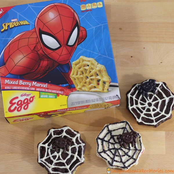 Chocolate dipped spider web waffles make a spooky fun Halloween treat. This spider web dessert is super simple and kids can help make them. Perfect for a Halloween party or a spider web treat for the family. Sponsored by #LeggoMyEggo #HearTheNews [ad]