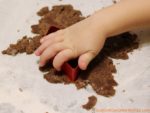 Cut the cookie dough to make chocolate train cookies.