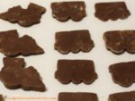 Cut the cookie dough to make chocolate train cookies.