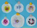 Use Sharpie permanent markers and Mr. Sketch scented markers to make color tie dye Christmas ornaments. This combination of science and art makes for a fantastic STEAM project for kids. Sponsored by #GiveColorfully
