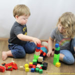 Block stacking is a great sibling activity.