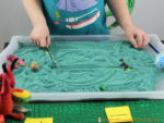 Set up a dragon themed sensory writing tray is to practice pre-writing skills, letter formation, handwriting, and more!