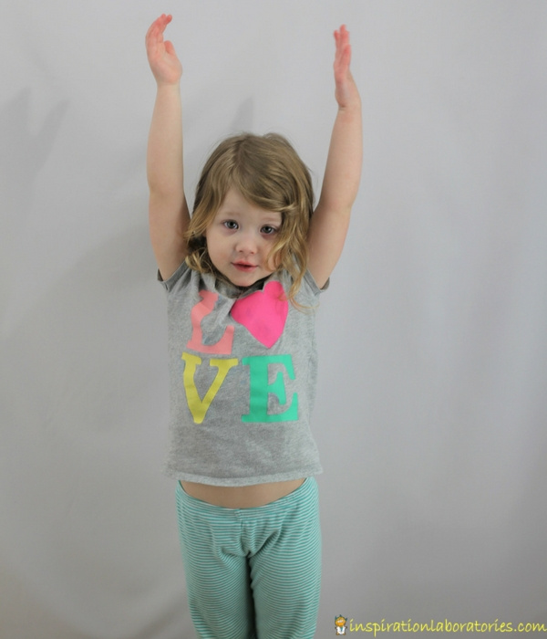 girl reaching arms up