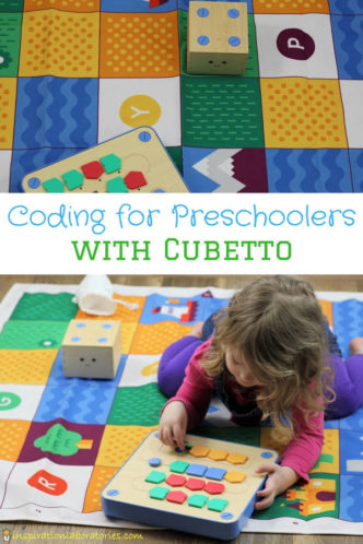 preschool girl programming Cubetto, a wooden cube robot with text overlay: Coding for Preschoolers with Cubetto