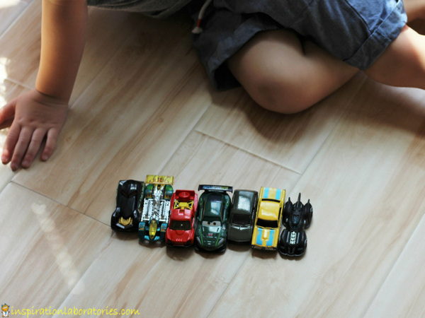 toy cars lined up on the floor