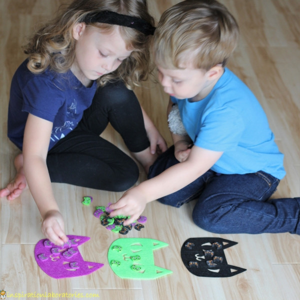 Use cat erasers and felt cats for 4 simple Halloween games that practice colors, counting, and get kids moving.