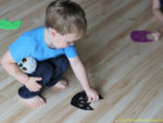 Use cat erasers and felt cats for a simple preschool Halloween game that practices colors, following directions, and gets kids moving.