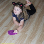 Use cat erasers and felt cats for a simple preschool Halloween game that practices colors, following directions, and gets kids moving.