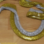 Learn how to make glitter glue saline solution slime.