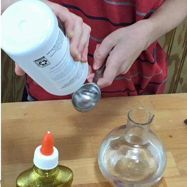 adding saline solution to slime