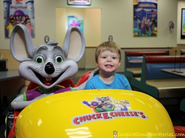 taking a photo with Chuck E. Cheese