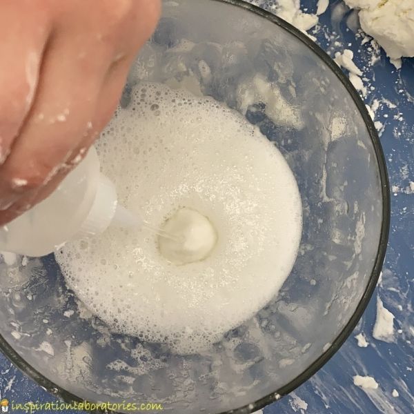 add vinegar to watch play dough fizz and foam